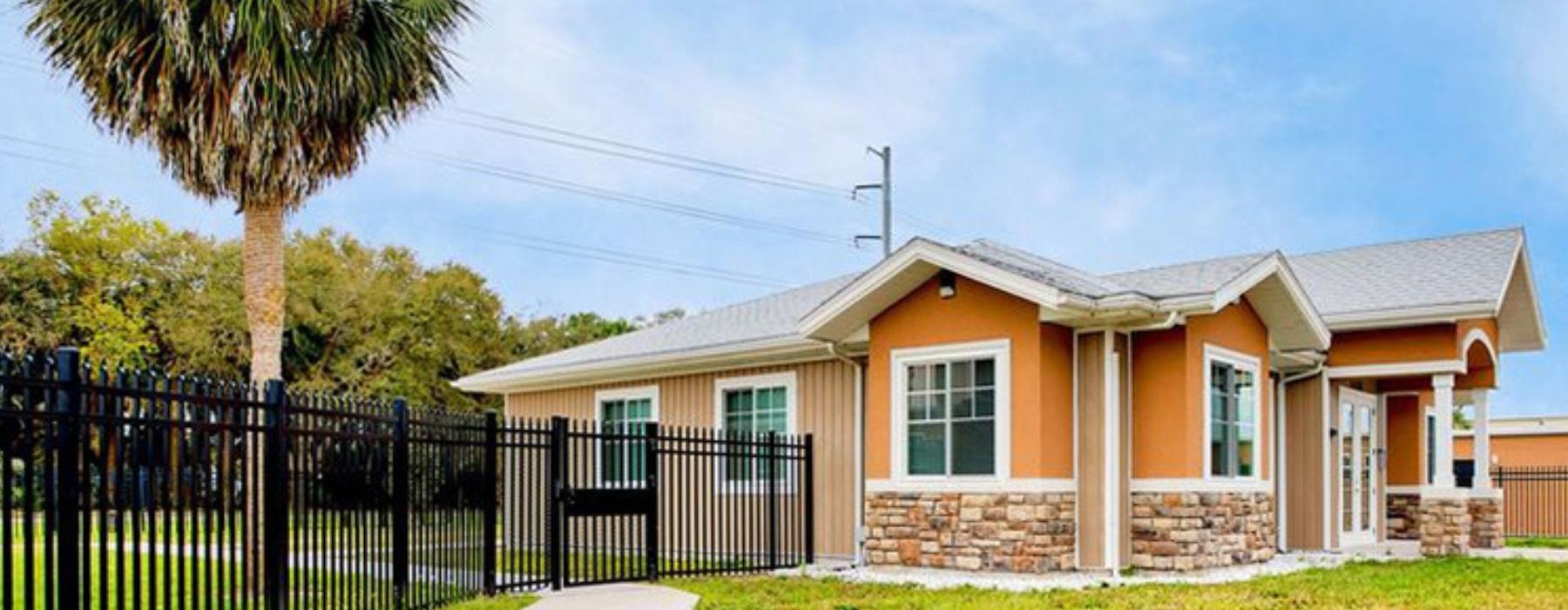a house with a black fence